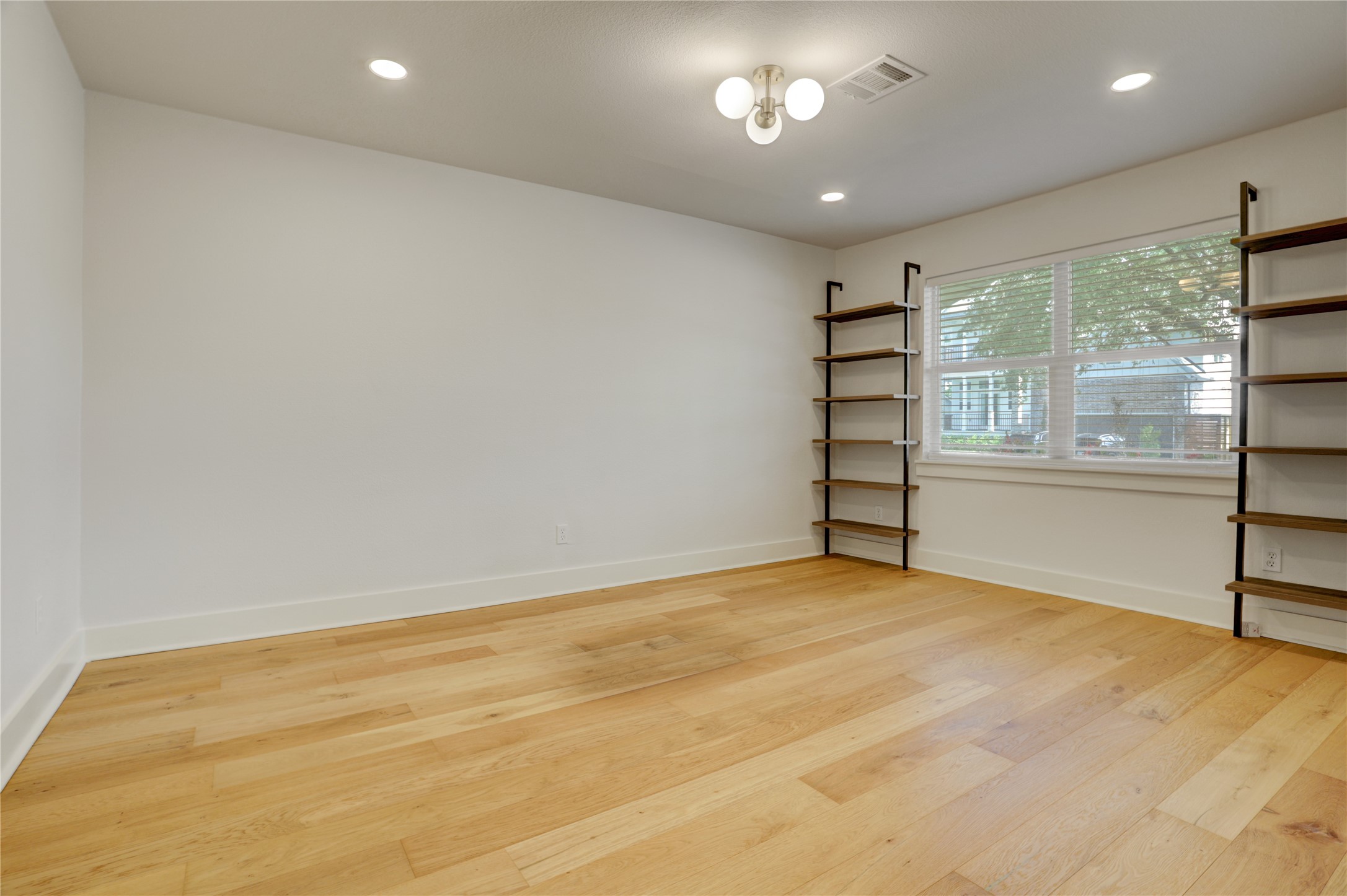 5514 Indigo Street Houston, TX 77096 - Photo 5 of 22 an empty room with a empty space and windows