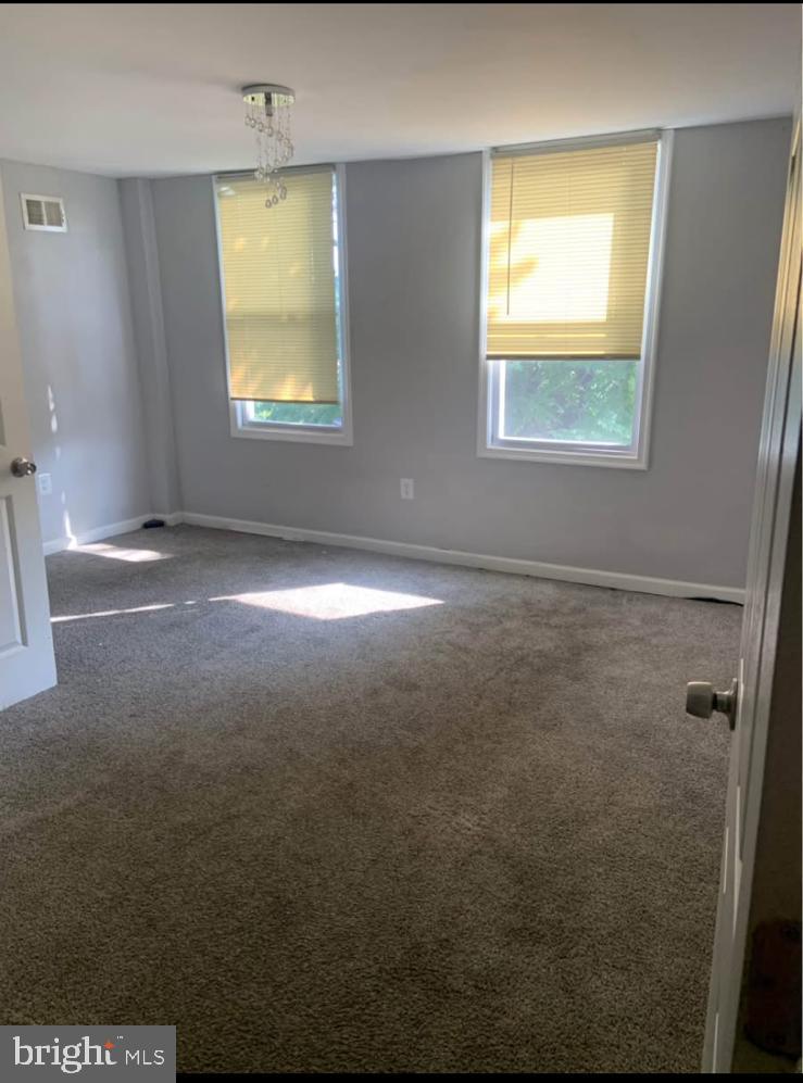 2118 Druid Hill Avenue, Unit 2 Baltimore, MD 21217 - Photo 2 of 9 a view of an empty room with a window