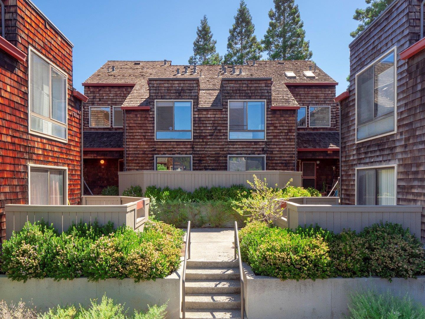 124 Peter Coutts Circle Stanford, CA 94305 - Photo 1 of 17 front view of a brick house with a yard
