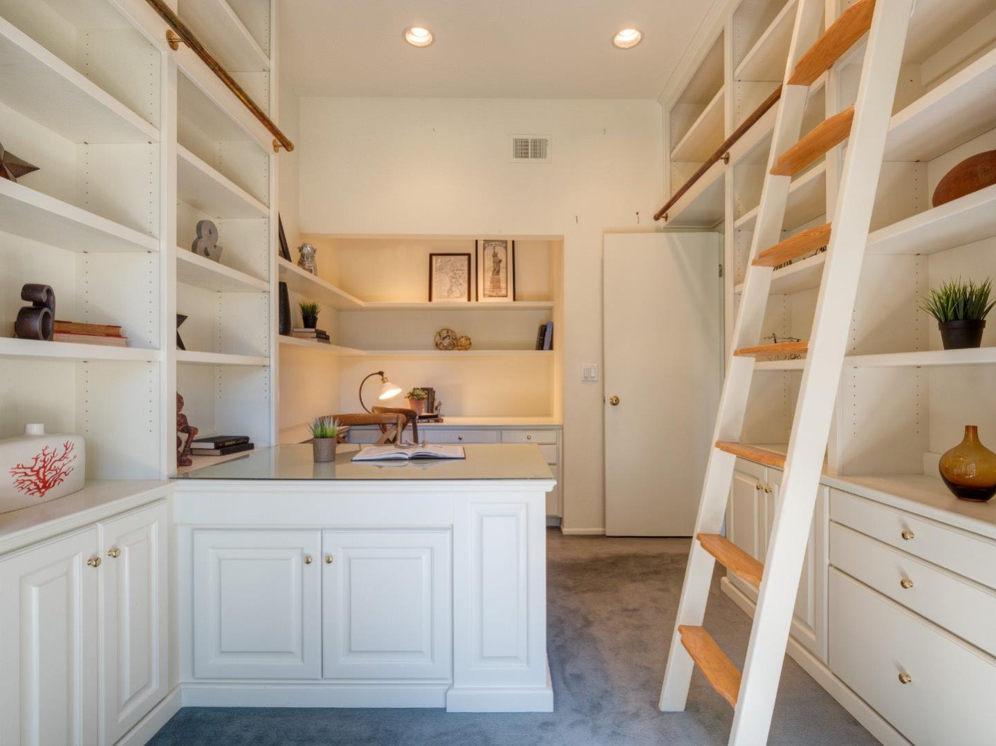 124 Peter Coutts Circle Stanford, CA 94305 - Photo 13 of 17 a kitchen with cabinets and wooden floor