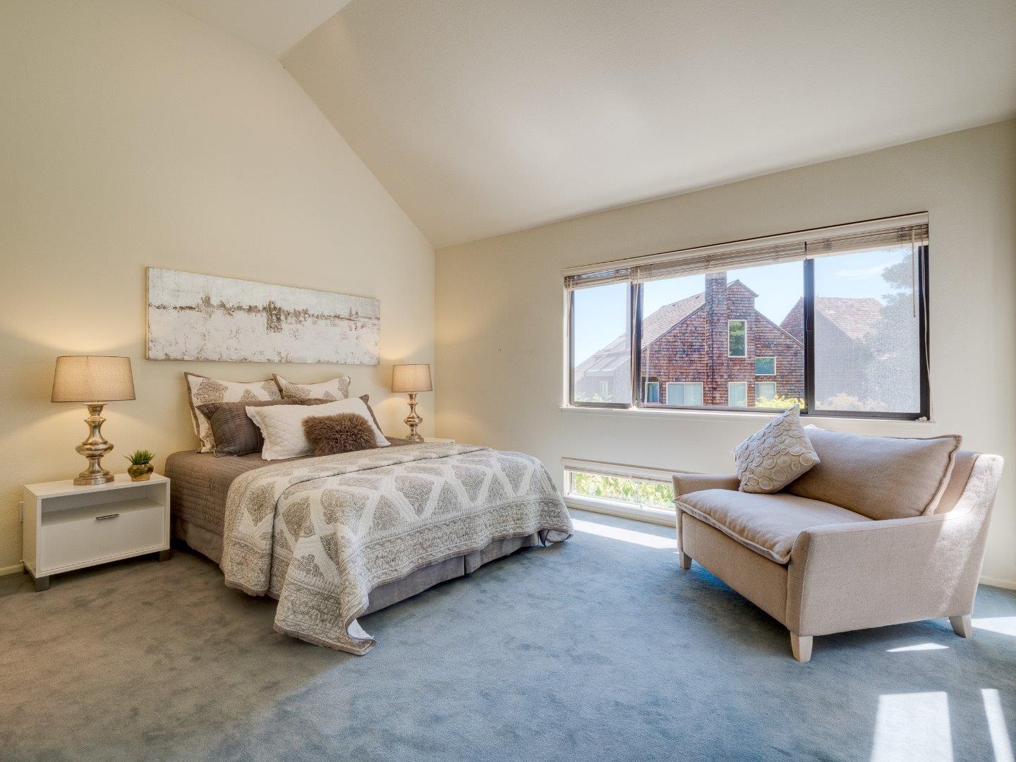 124 Peter Coutts Circle Stanford, CA 94305 - Photo 14 of 17 a spacious bedroom with a bed and a couch with window