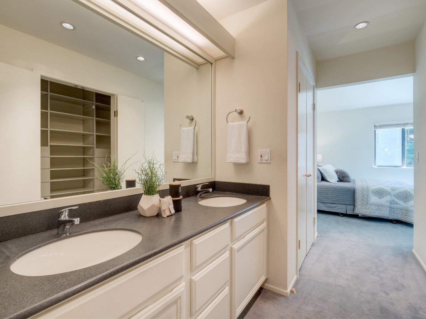 124 Peter Coutts Circle Stanford, CA 94305 - Photo 15 of 17 a en suite bathroom with sink and mirror