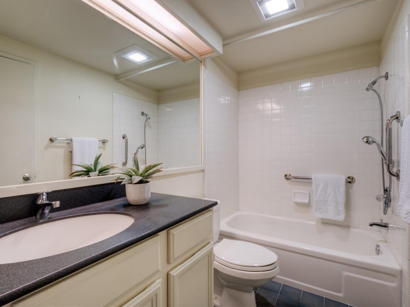 124 Peter Coutts Circle Stanford, CA 94305 - Photo 6 of 17 a bathroom with a sink a toilet and shower