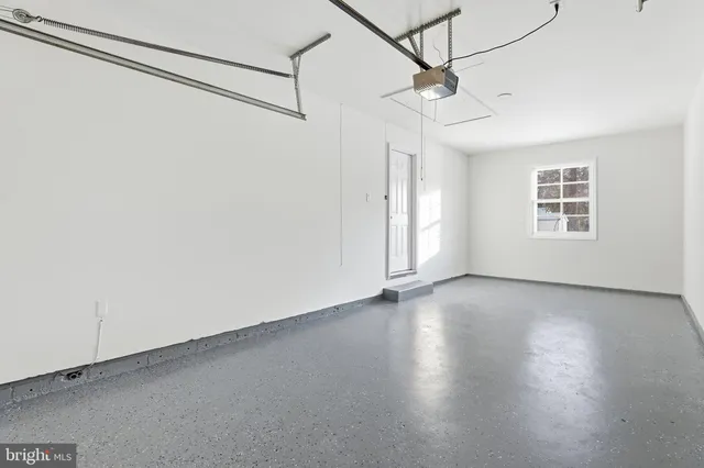 a view of a livingroom with a ceiling fan and window