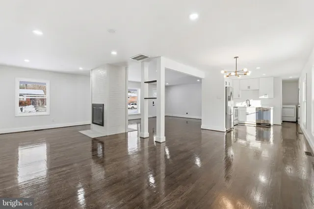 a view of kitchen with furniture and wooden floor