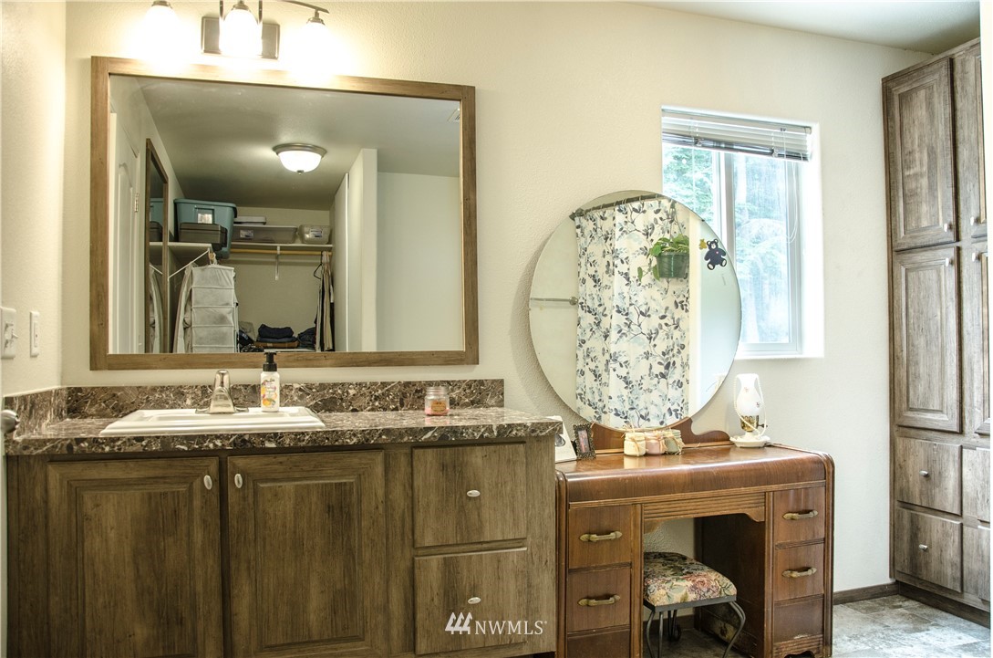 6510 Skinner Road Granite Falls, WA 98252 - Photo 14 of 19 a bathroom with a sink and a mirror