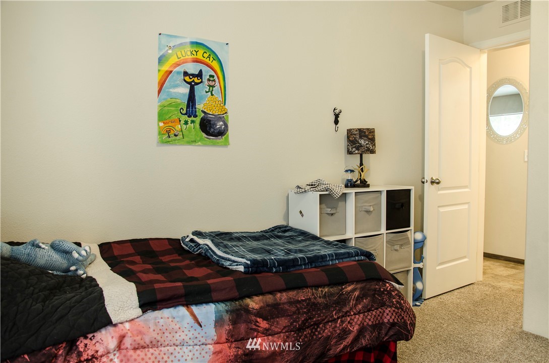 6510 Skinner Road Granite Falls, WA 98252 - Photo 15 of 19 a bedroom with a bed and a dresser