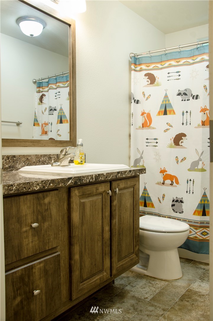 6510 Skinner Road Granite Falls, WA 98252 - Photo 16 of 19 a bathroom with a sink toilet and shower