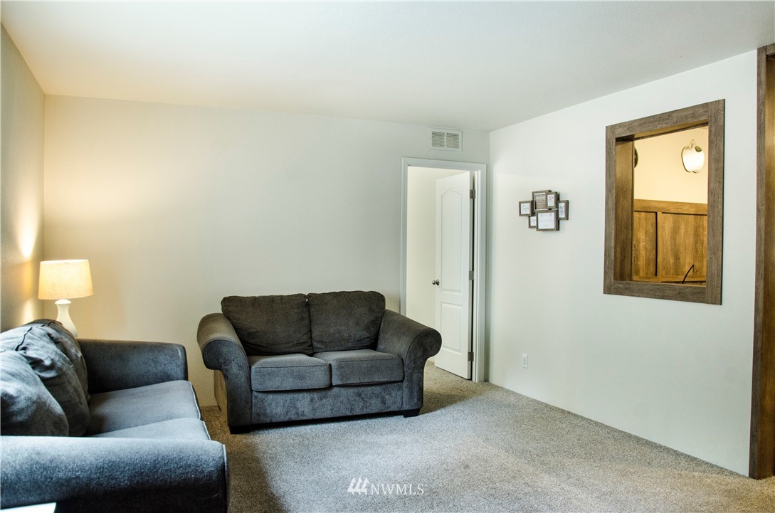 6510 Skinner Road Granite Falls, WA 98252 - Photo 6 of 19 a living room with furniture and a window