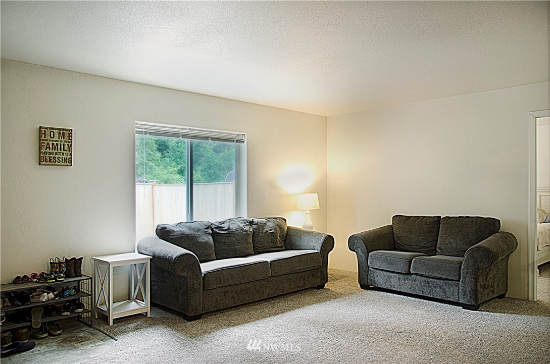 6510 Skinner Road Granite Falls, WA 98252 - Photo 7 of 19 a living room with furniture a couch and a window