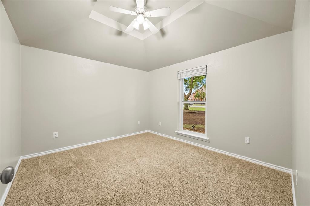 909 Valley View Avenue Red Oak, TX 75154 - Photo 25 of 37 an empty room with a window and a fan