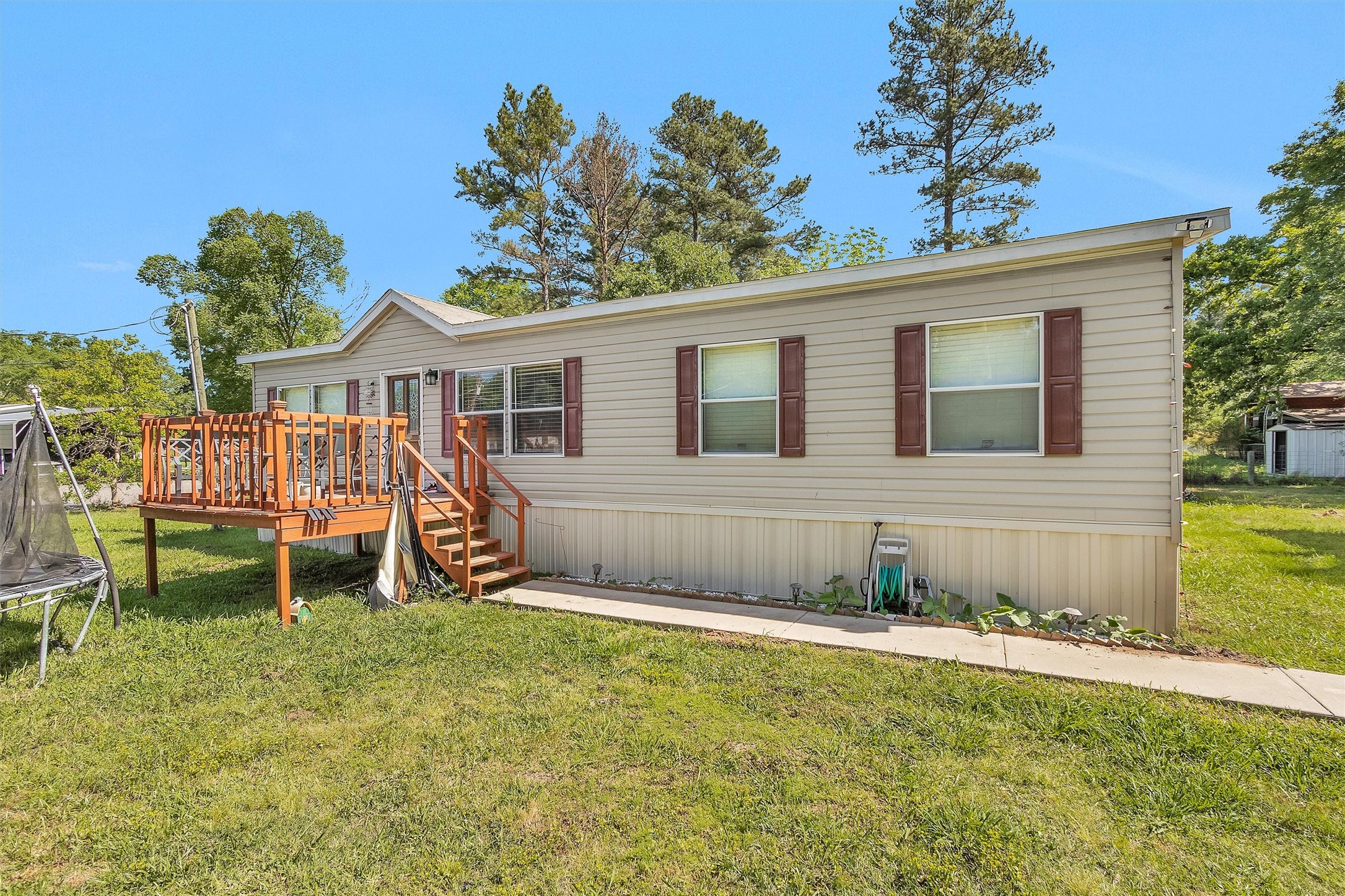56 Michael Street Huntsville, TX 77320 - Photo 2 of 37 a view of a house with a yard and sitting area
