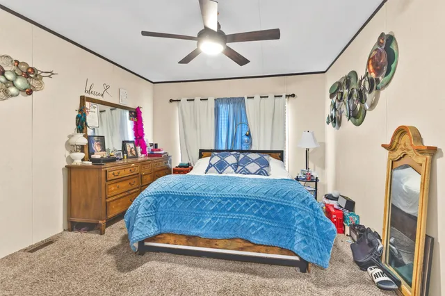 a bedroom with a bed and cabinets