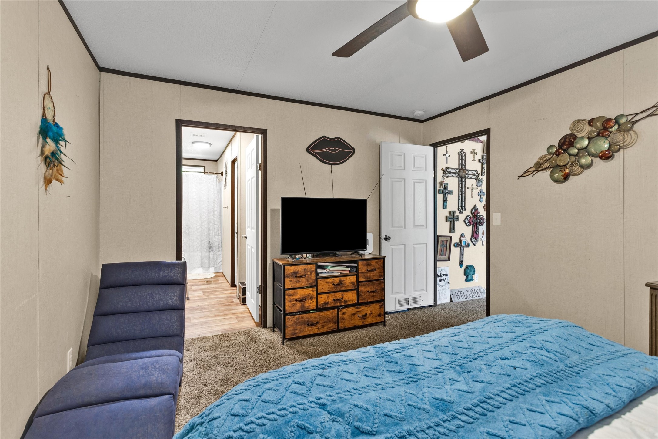 56 Michael Street Huntsville, TX 77320 - Photo 23 of 37 a living room with furniture and a flat screen tv