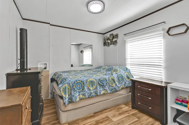 a bedroom with a bed and a dresser