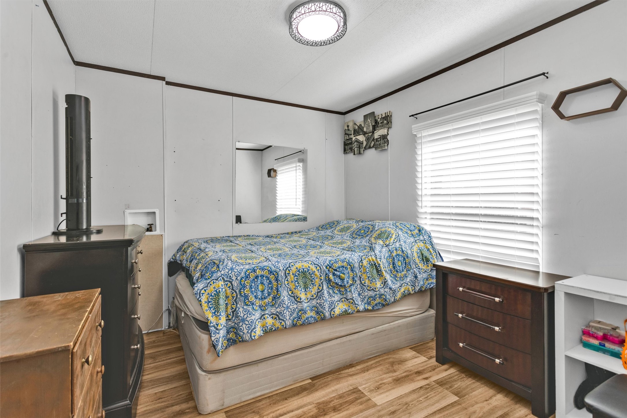 56 Michael Street Huntsville, TX 77320 - Photo 25 of 37 a bedroom with a bed and a dresser