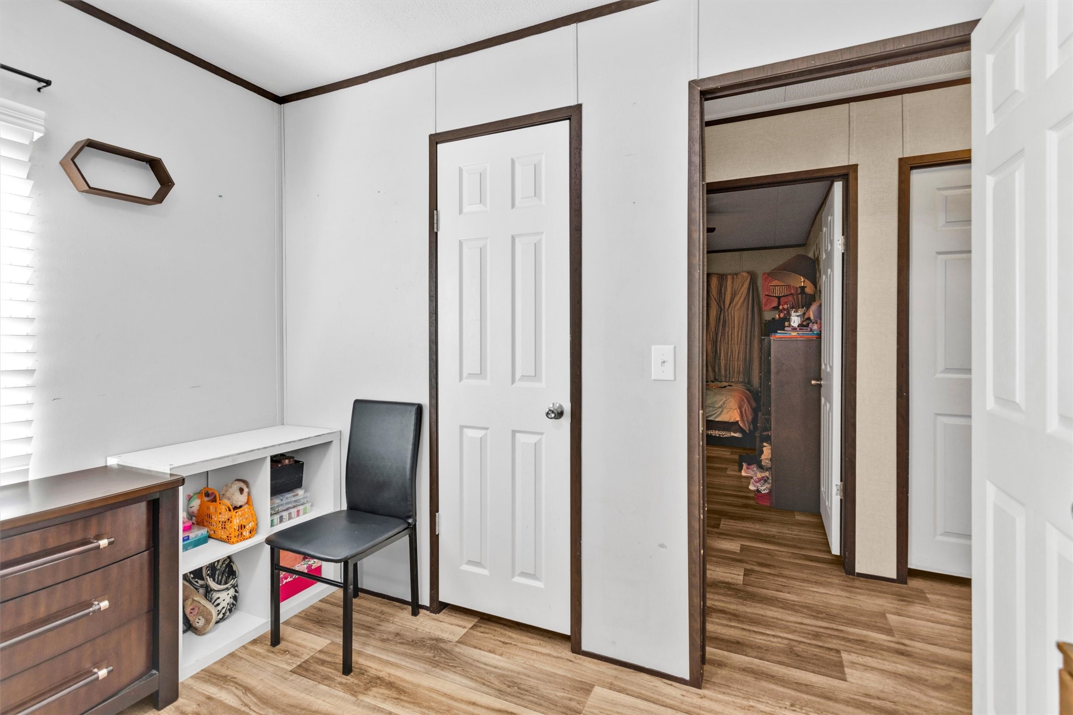 56 Michael Street Huntsville, TX 77320 - Photo 27 of 37 a view of a hallway with wooden floor and closet
