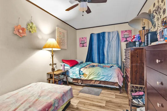 a bedroom with a bed and a lamp