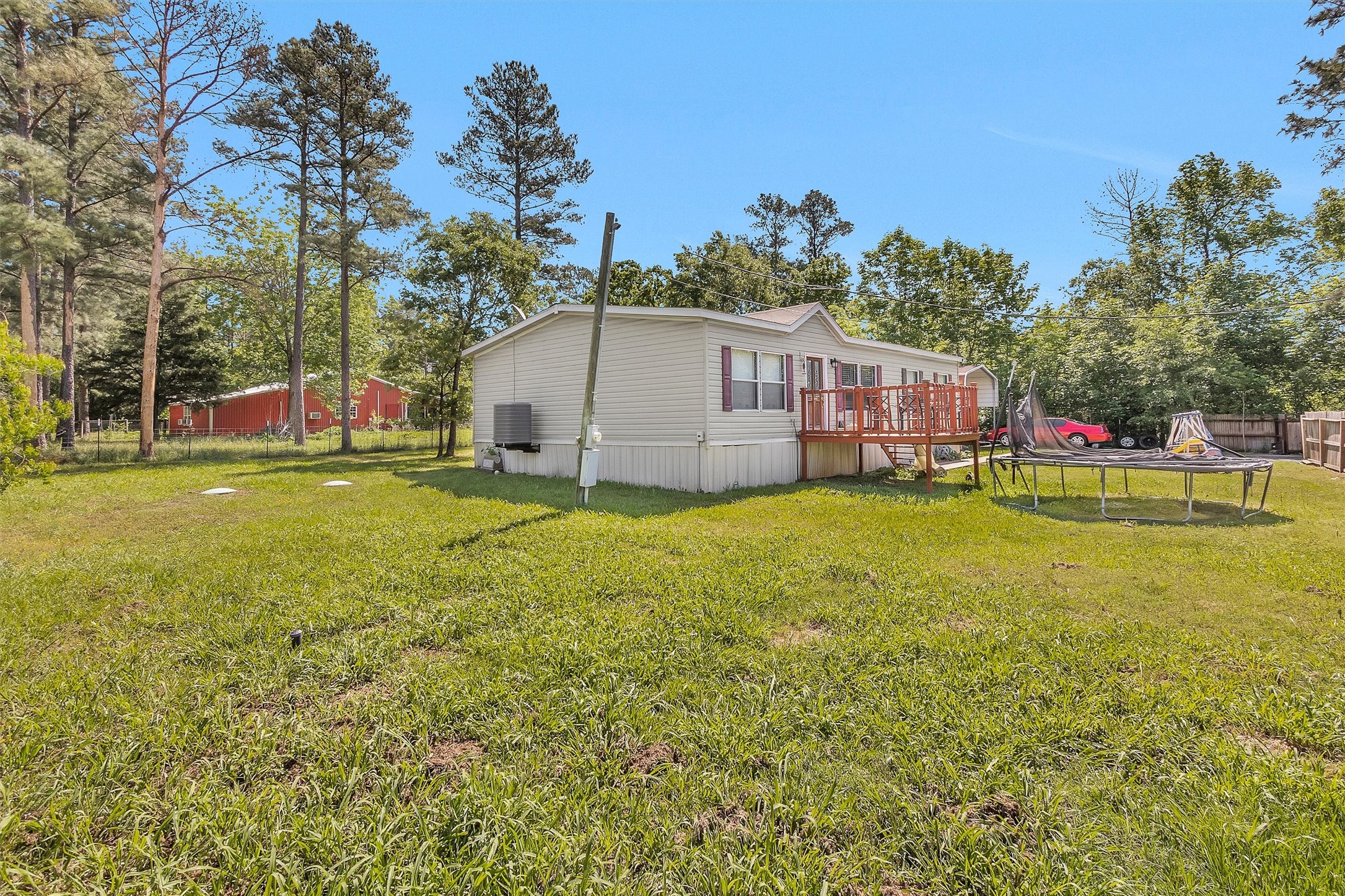 56 Michael Street Huntsville, TX 77320 - Photo 3 of 37 a view of a house with a big yard and sitting area