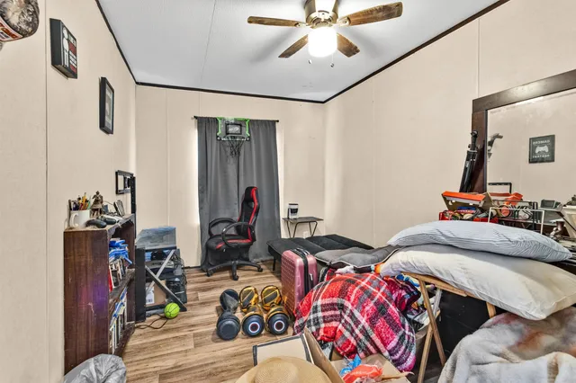 a bedroom with bed and a window