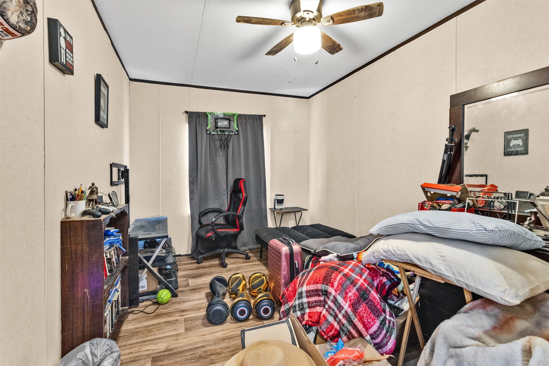 56 Michael Street Huntsville, TX 77320 - Photo 31 of 37 a bedroom with bed and a window