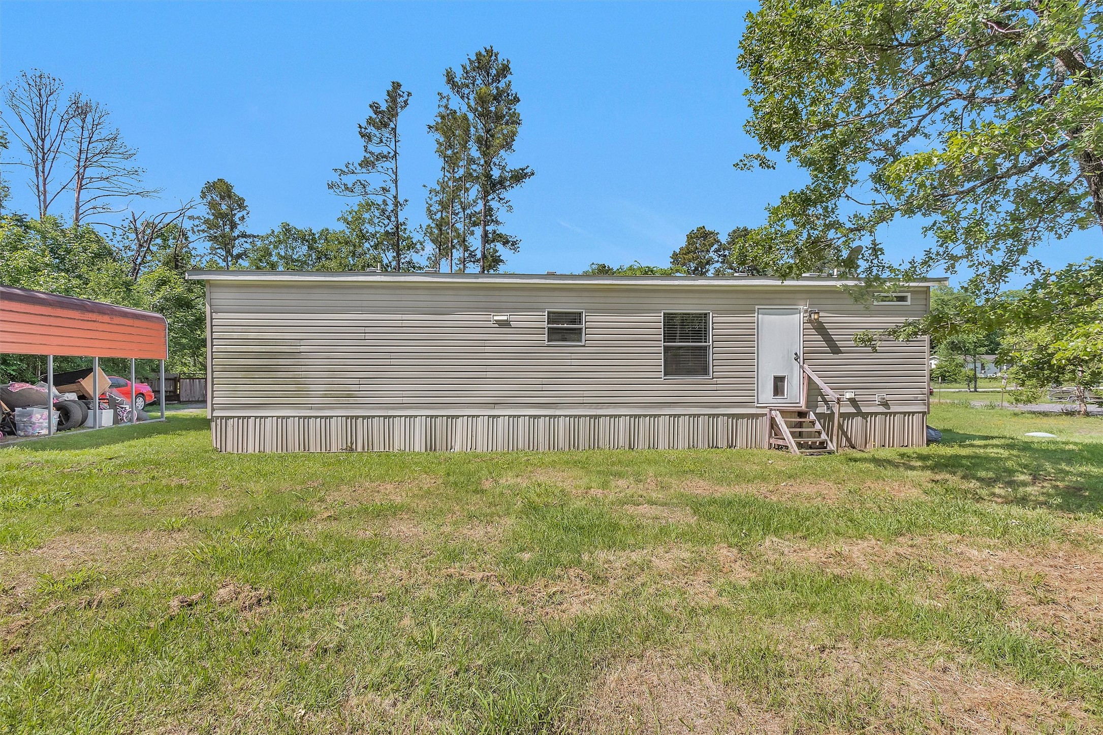 56 Michael Street Huntsville, TX 77320 - Photo 33 of 37 a view of a backyard