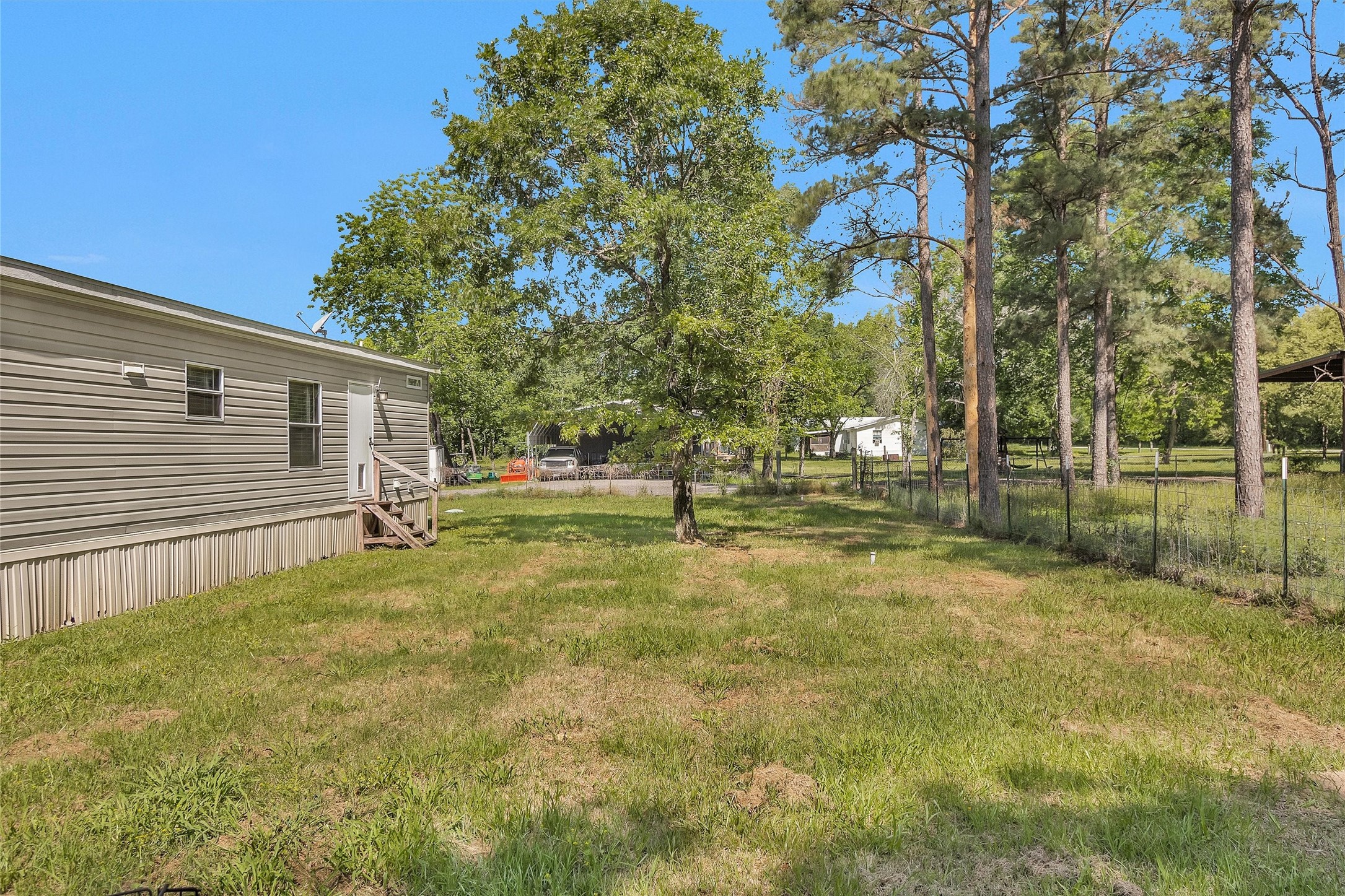 56 Michael Street Huntsville, TX 77320 - Photo 35 of 37 a view of a yard with basketball court