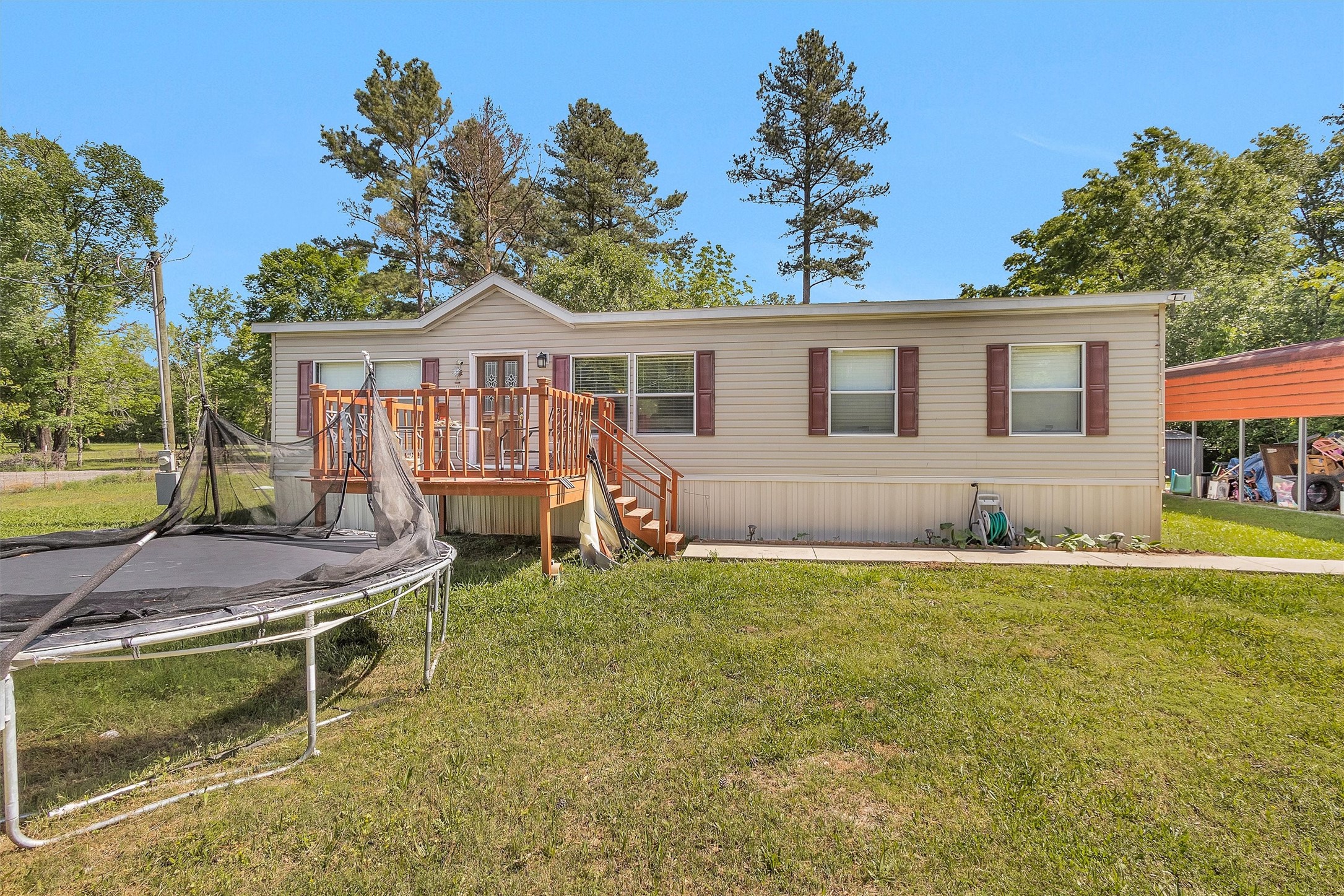 56 Michael Street Huntsville, TX 77320 - Photo 4 of 37 a house view with a garden space