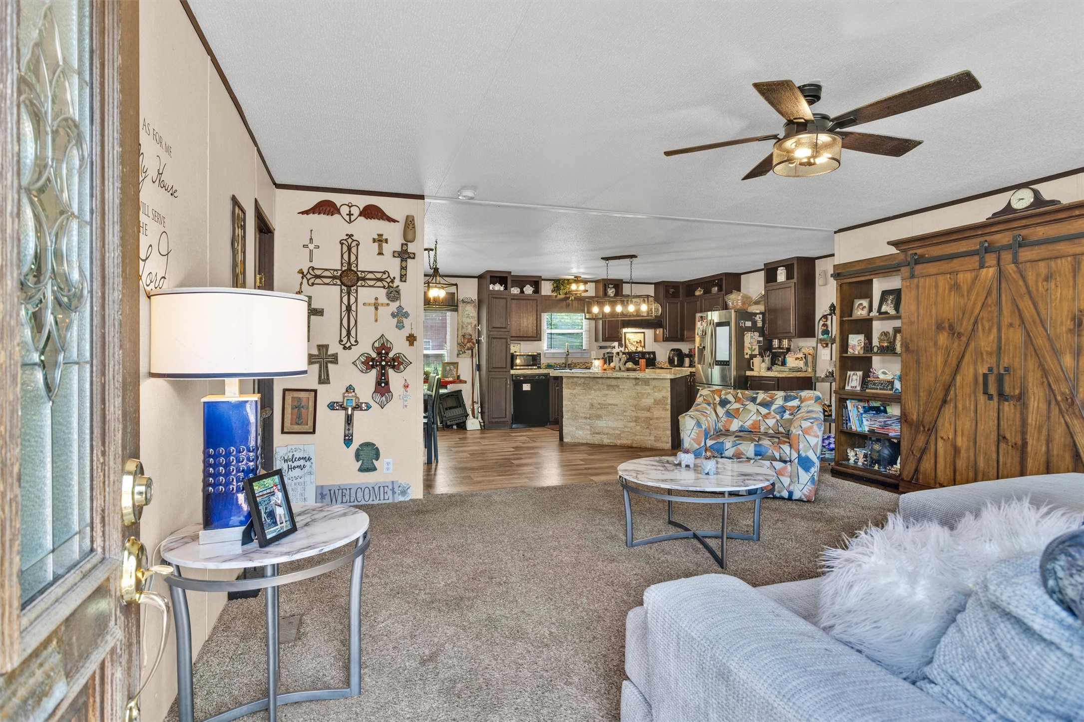 56 Michael Street Huntsville, TX 77320 - Photo 7 of 37 a living room with fireplace furniture and a rug