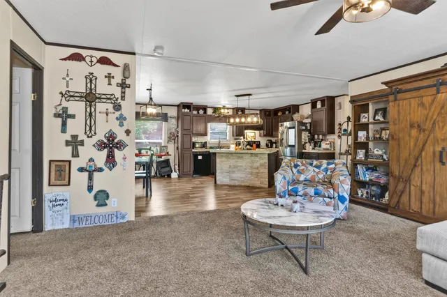 a living room with lots of furniture and white walls