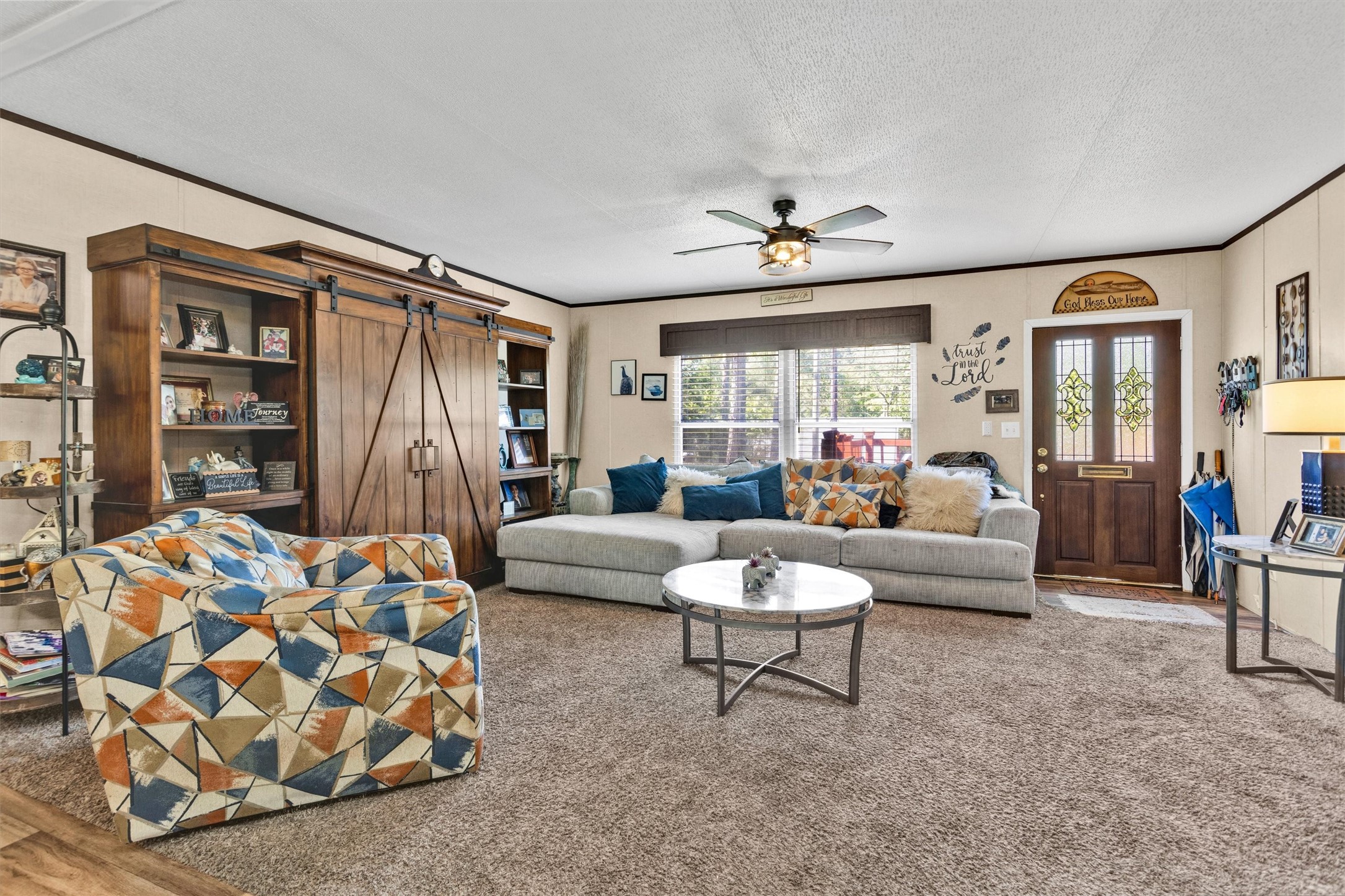56 Michael Street Huntsville, TX 77320 - Photo 10 of 37 a living room with furniture and a rug