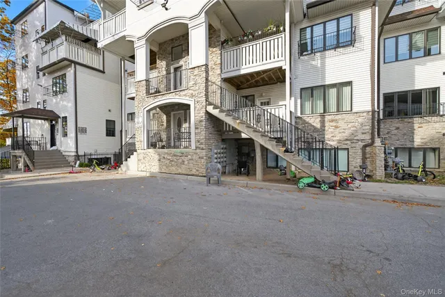 a couple of cars parked in front of a building