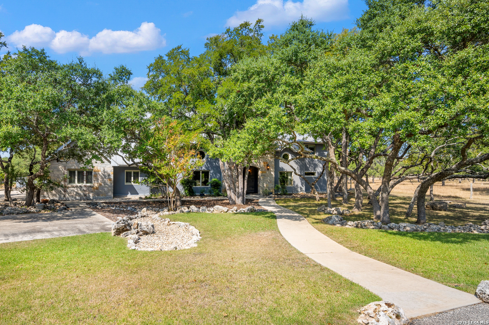 613 Saxet Trail Spring Branch, TX 78070 - Photo 2 of 50 a view of a swimming pool with an outdoor space