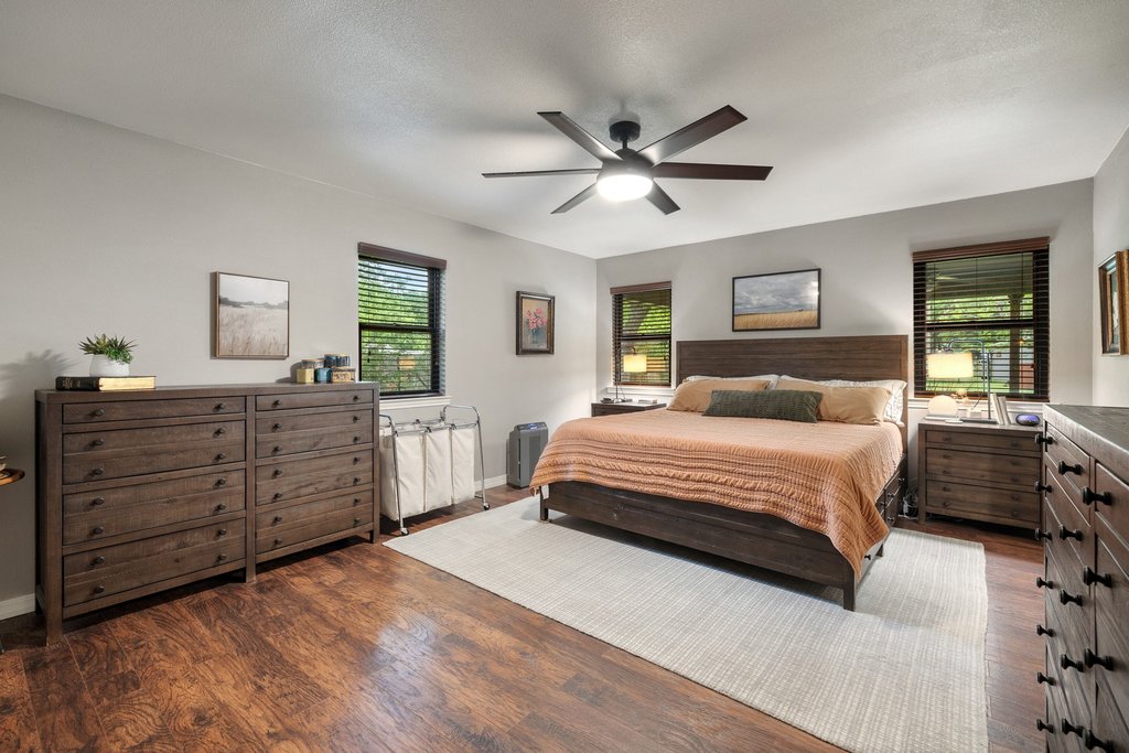 302 South Schramm Road Granger, TX 76530 - Photo 15 of 33 a bedroom with a bed and a dresser