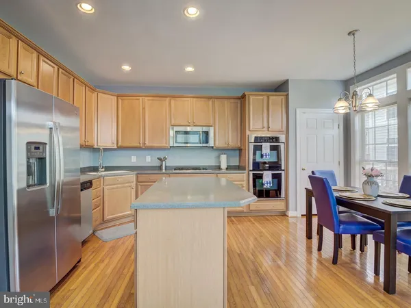 a dining room with furniture window wooden floor