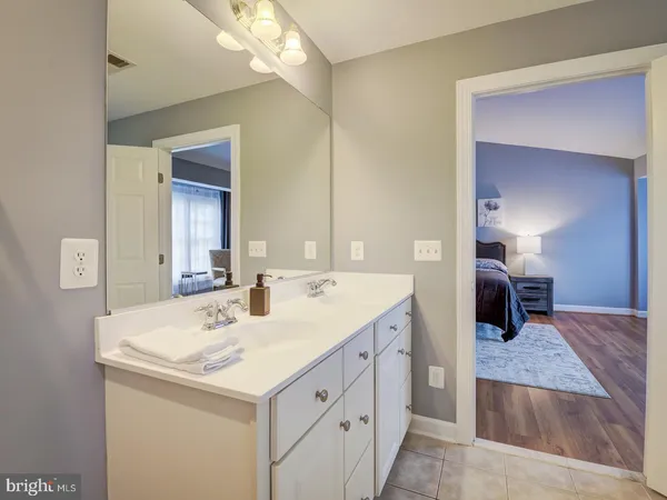 a bathroom with a sink toilet and a mirror