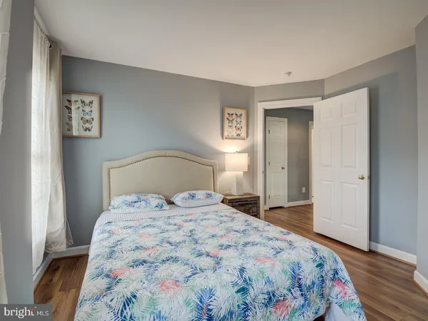 a spacious bedroom with a large bed and a couch