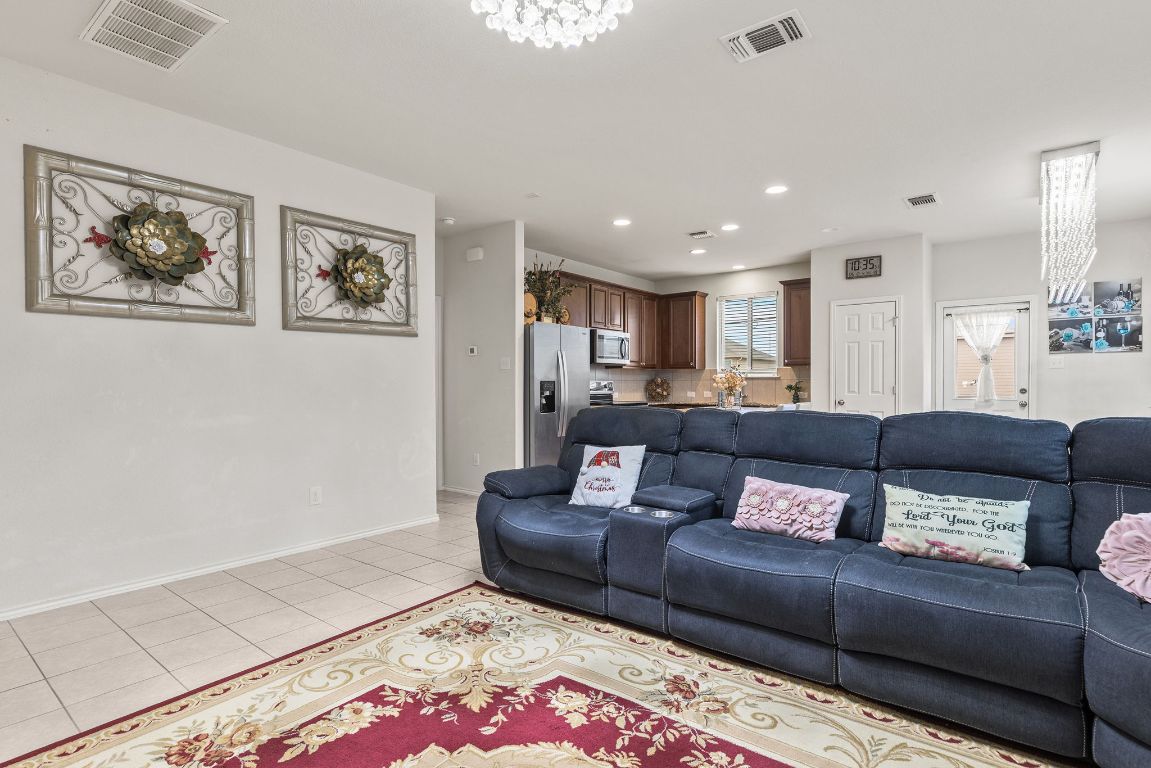 209 Ibis Falls Loop Jarrell, TX 76537 - Photo 11 of 40 a living room with furniture and a rug