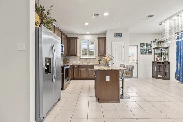 a kitchen with granite countertop a sink and a window
