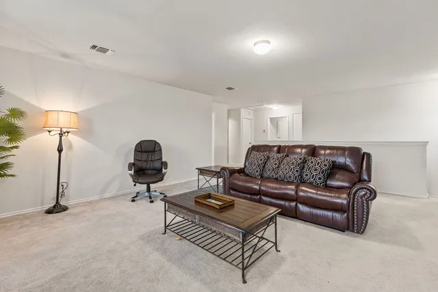 an empty room with closet and windows