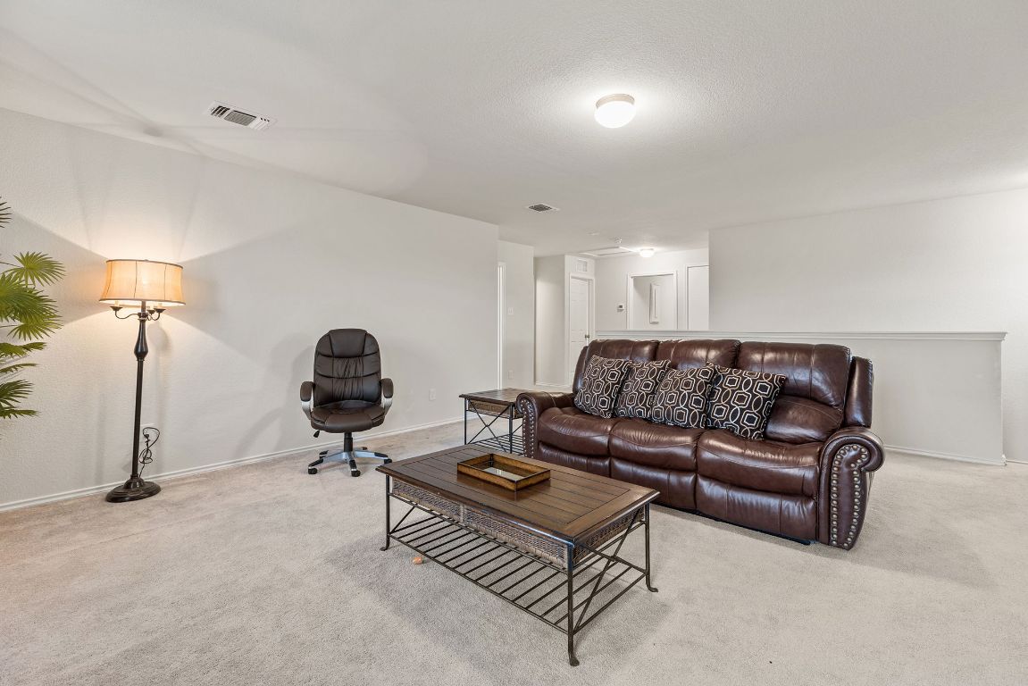 209 Ibis Falls Loop Jarrell, TX 76537 - Photo 24 of 40 a living room with furniture