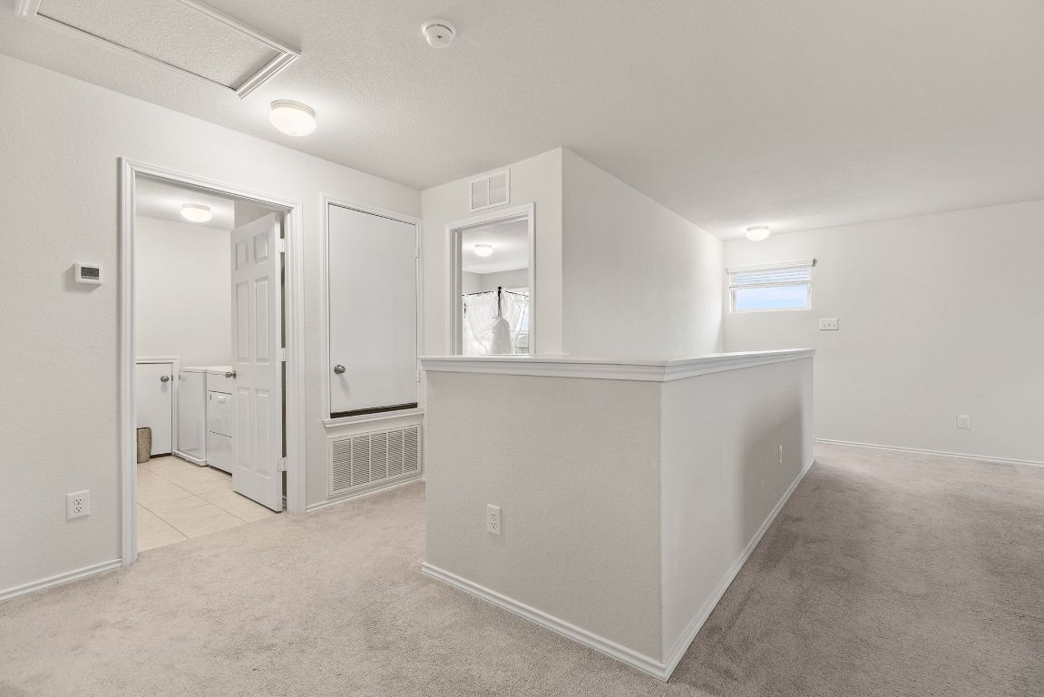 209 Ibis Falls Loop Jarrell, TX 76537 - Photo 25 of 40 an empty room with closet and windows