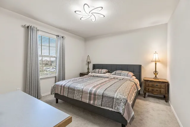 a bedroom with a bed and a dresser