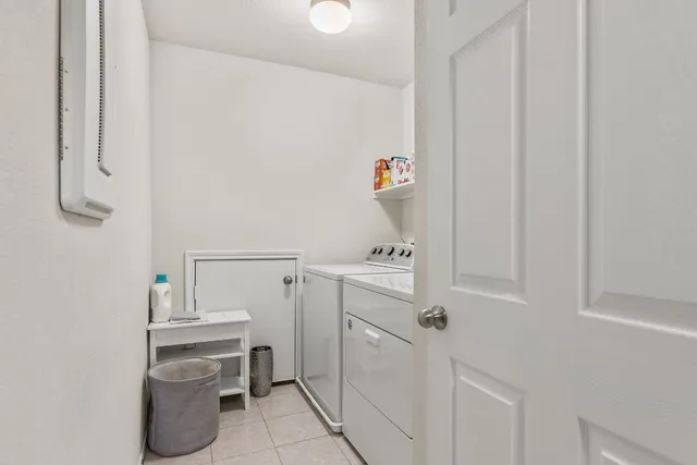 a view of a swimming pool with a yard