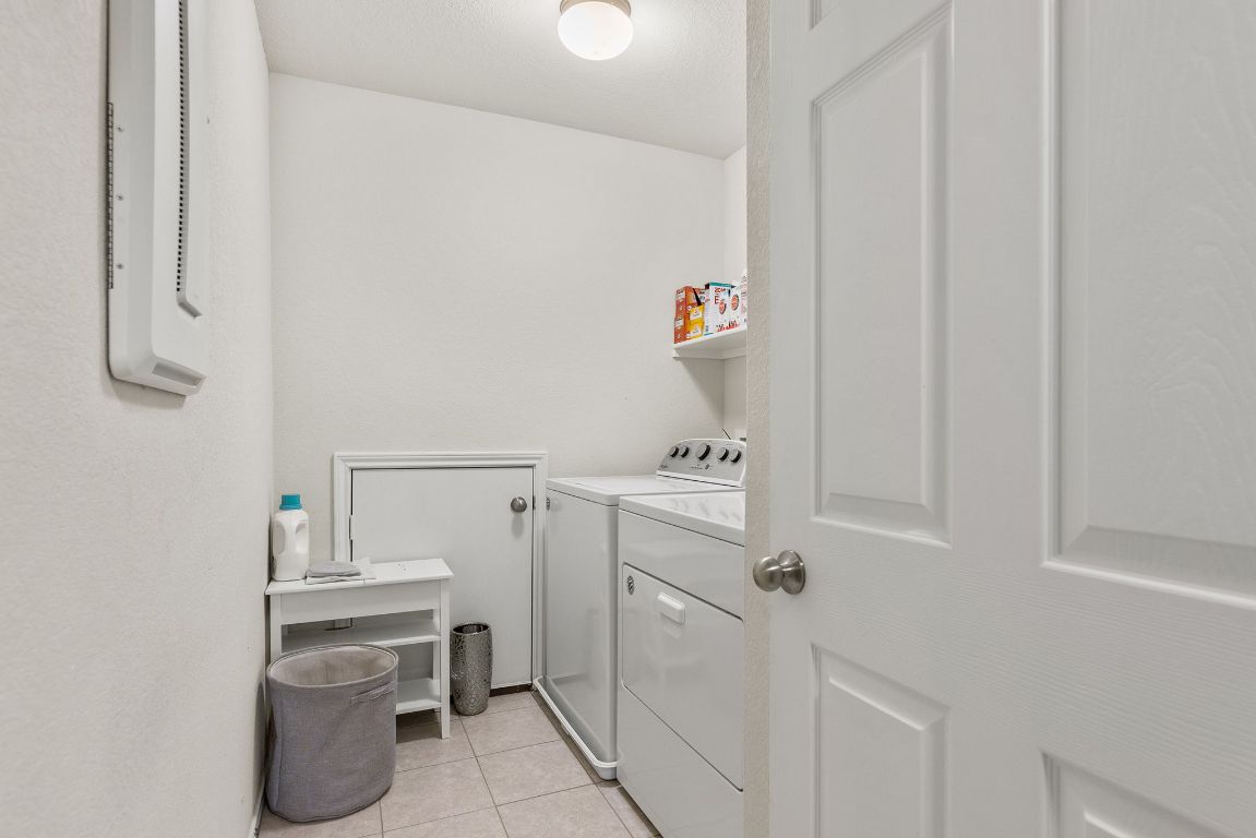 209 Ibis Falls Loop Jarrell, TX 76537 - Photo 33 of 40 a room with storage and utility