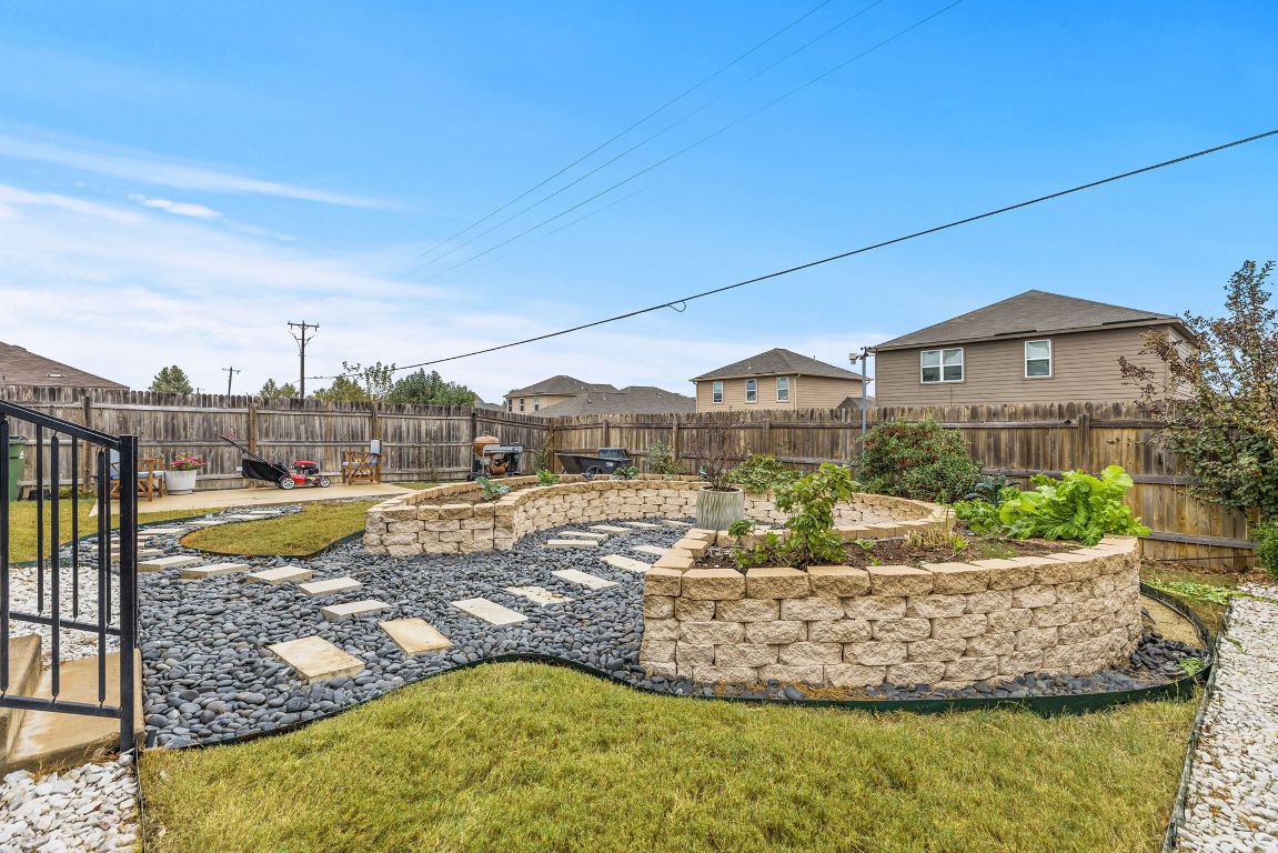 209 Ibis Falls Loop Jarrell, TX 76537 - Photo 34 of 40 a view of a swimming pool with a yard