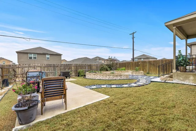 a backyard of a house with seating space