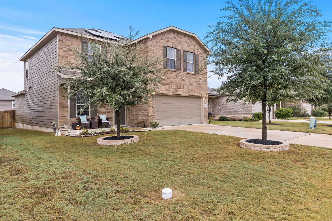 209 Ibis Falls Loop Jarrell, TX 76537 - Photo 39 of 40 a front view of a house with a yard