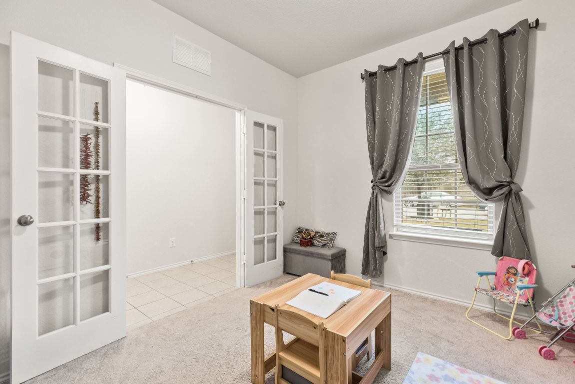 209 Ibis Falls Loop Jarrell, TX 76537 - Photo 7 of 40 a room with furniture and window