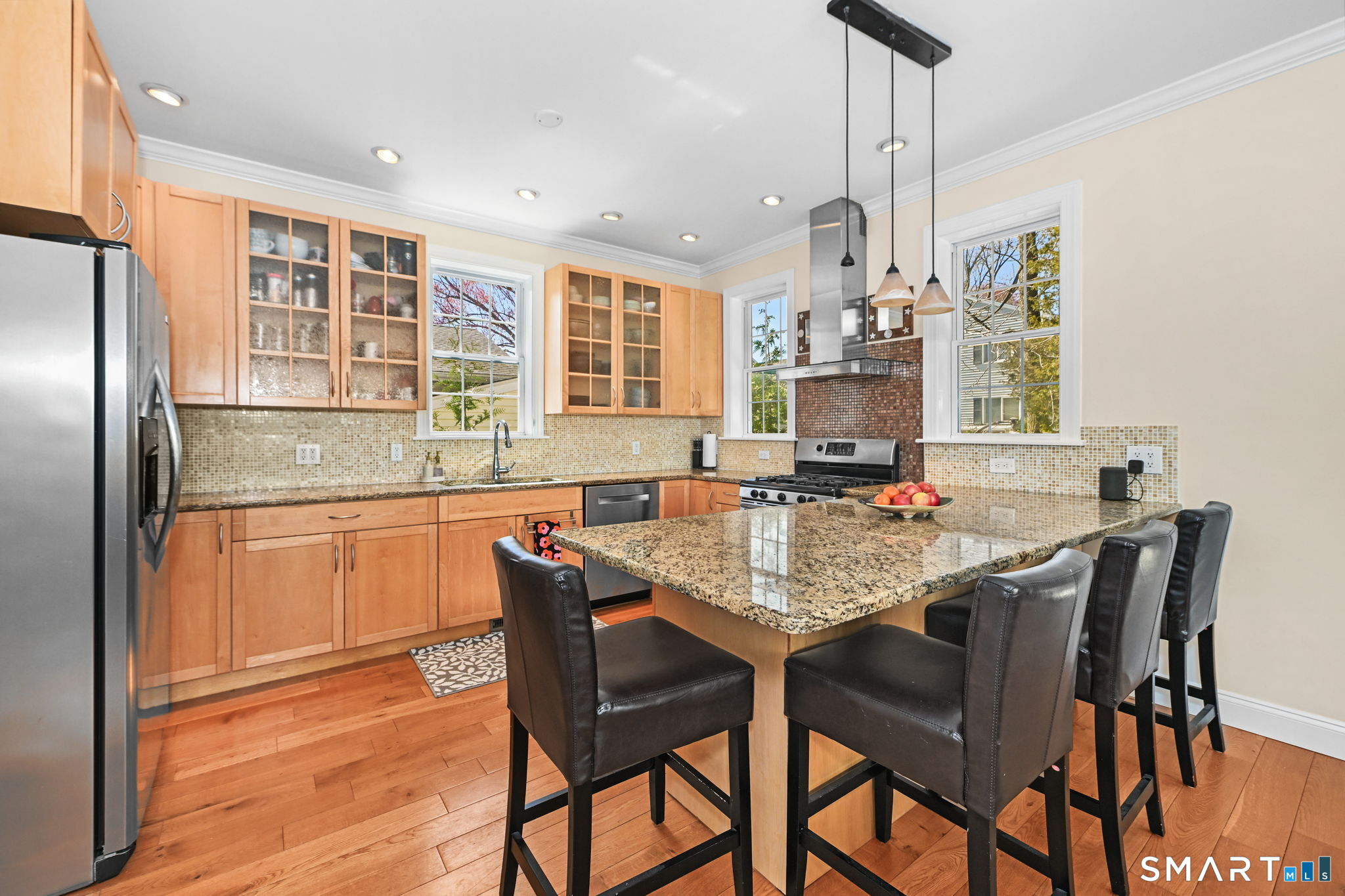 50 Berkeley Road Fairfield, CT 06825 - Photo 11 of 36 Airy kitchen with granite island and stainless steel appliances